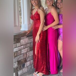 Red sequin formal, form fitting but has stretch. Sparkle day and night.